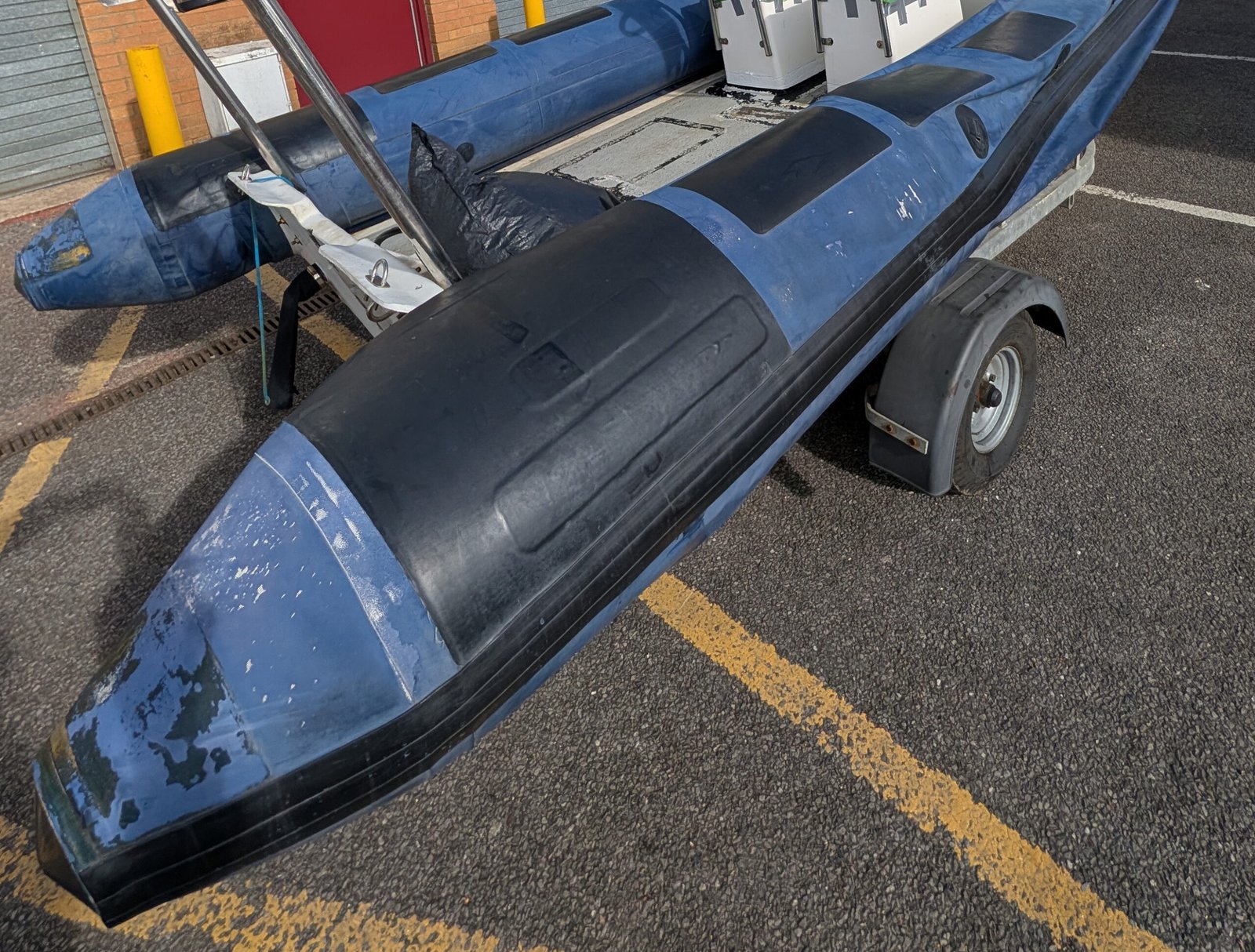End-of-life RIB tube showing delamination, UV degradation and worn outer coating