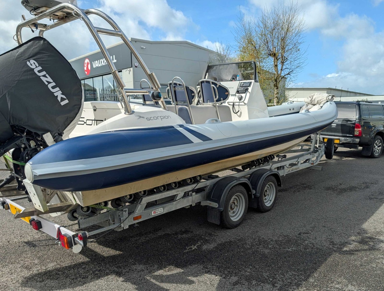 Scorpion RIB on trailer with new blue and light grey replacement tubes fitted